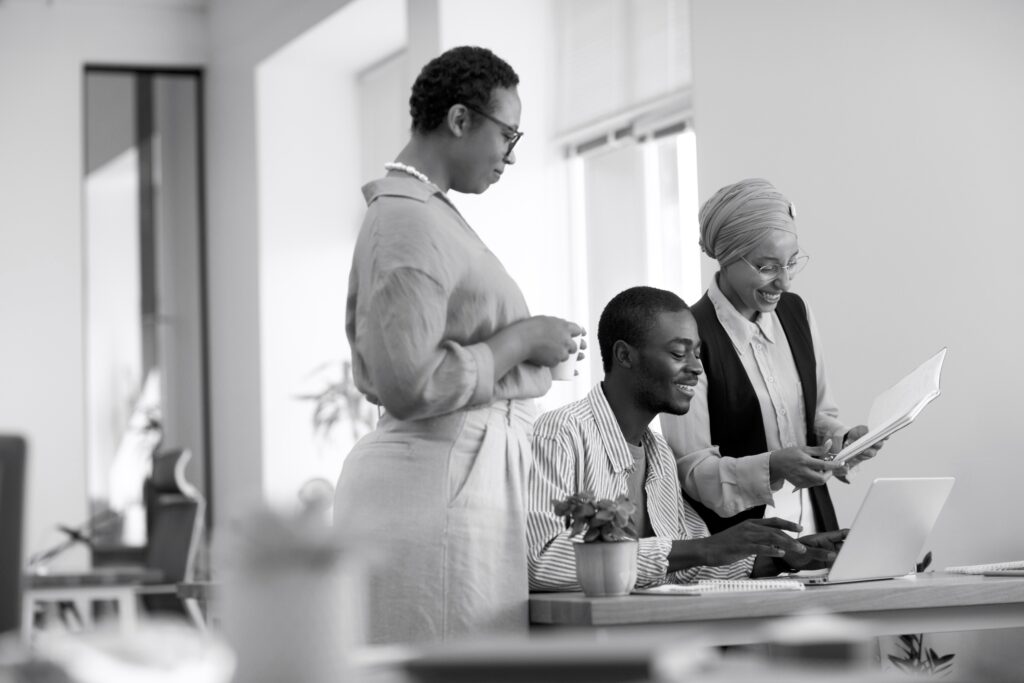 male employee getting used his new office job along with female colleagues copy